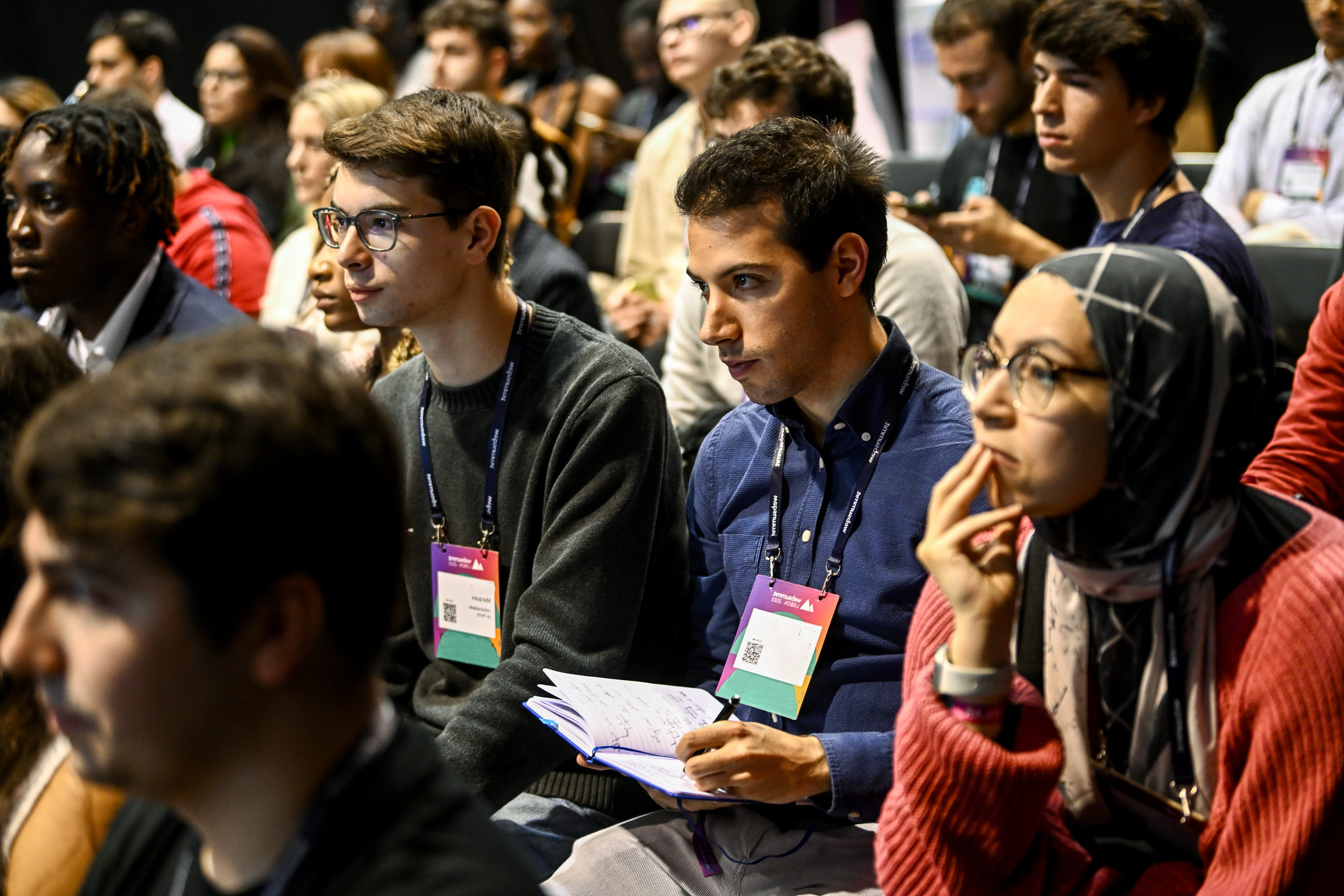 A view of an attendee taking notes at Masterclasses Stage during day two of Web Summit 2023 at the Altice Arena in Lisbon, Portugal