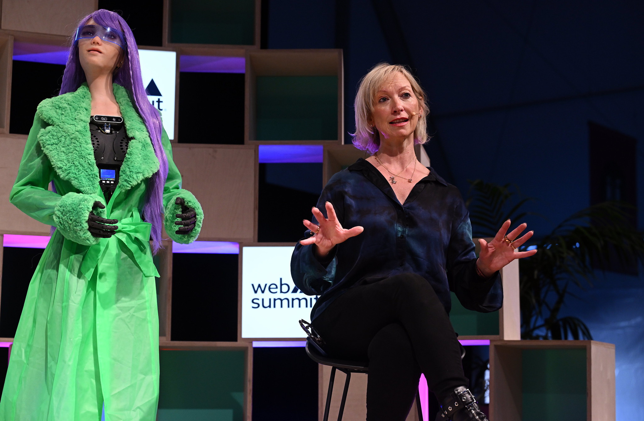 Desdemona x, Humanoid Robot, SingularityNET; left, and Janet Adams, COO, SingularityNET, on the Q&A Stage during day two of Web Summit 2023 at the Altice Arena in Lisbon, Portugal