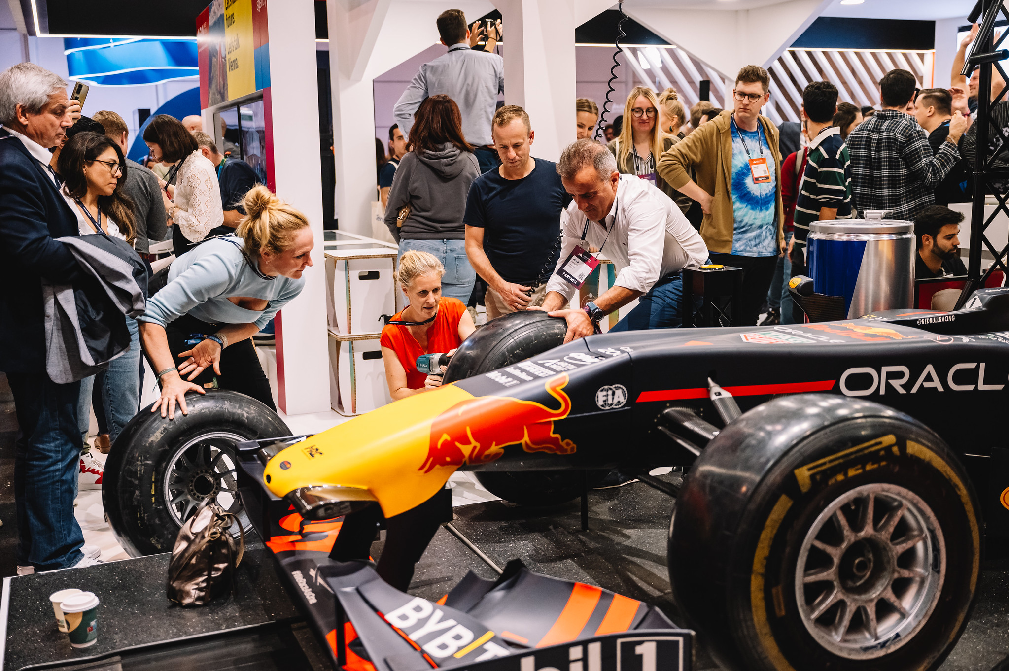 Oracle branded race car at partner booth at Web Summit 2023