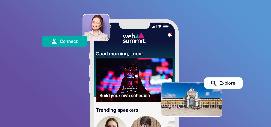 A mobile phone screen showing the Web Summit app, which features the Web Summit logo, the message 'Good morning, Lucy!', the message 'Build your own schedule' overlaid on an image of someone using their phone to take a photo of a Web Summit stage, and the title 'Trending speakers'. Around the phone are a photo of a person in business attire, a photo of Lisbon's Praça do Comércio, and two buttons that read 'Connect' and 'Explore'.