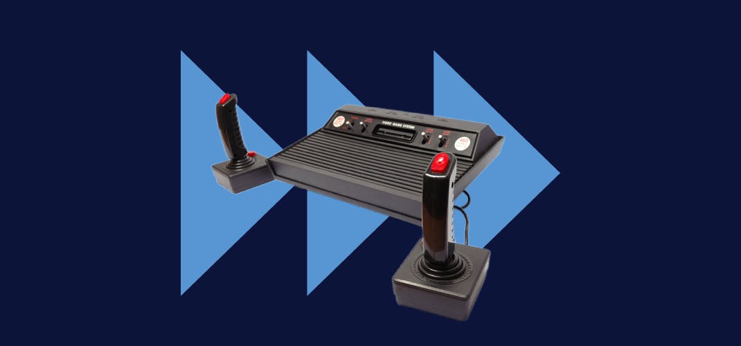 A cut-out image of a retro games console. The background contains three arrows in a row, pointing to the right.