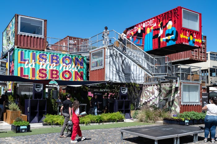 Bar in Lisbon made of shipping containers covered in graffiti