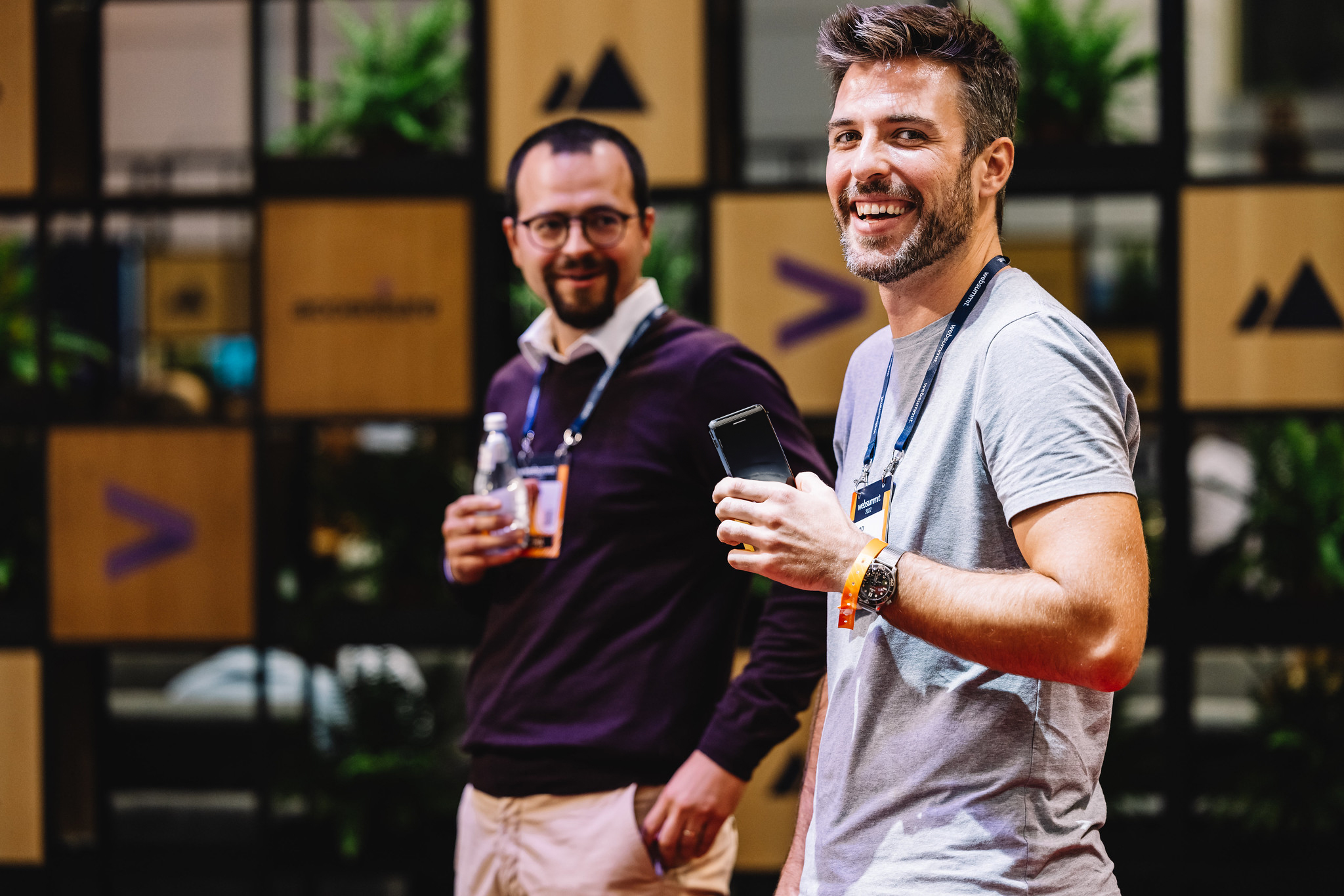 Two attendees walking around Web Summit