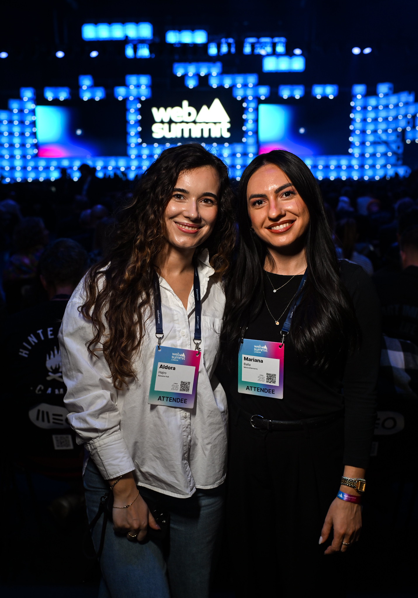 Two attendees posing together during opening night