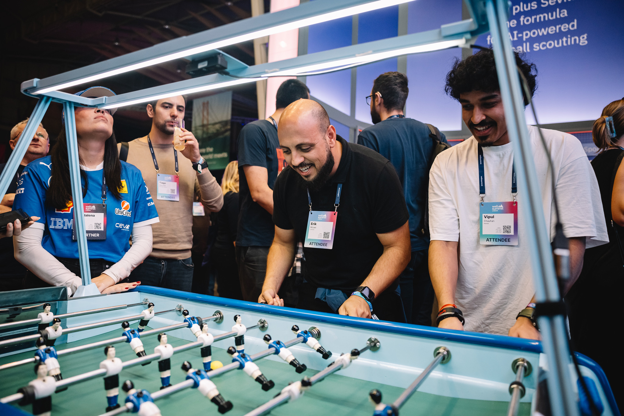 Attendees playing table football at the IBM Happy Hour
